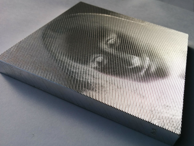 picture of Mona Lisa cut on aluminum (side)